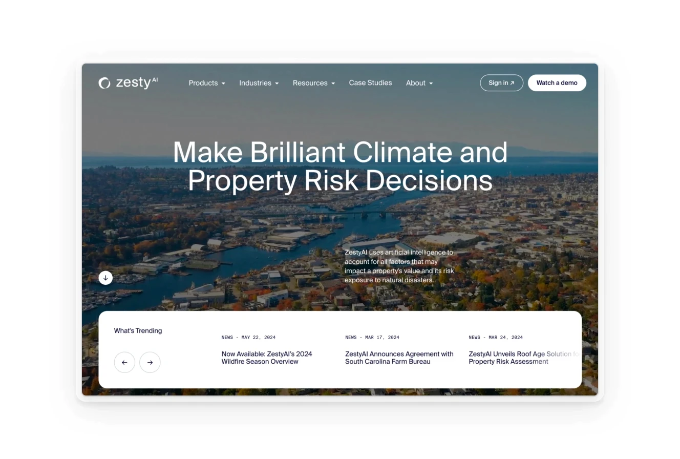 Homepage of Zesty AI featuring an aerial view of a city, promoting AI solutions for climate and property risk decisions.