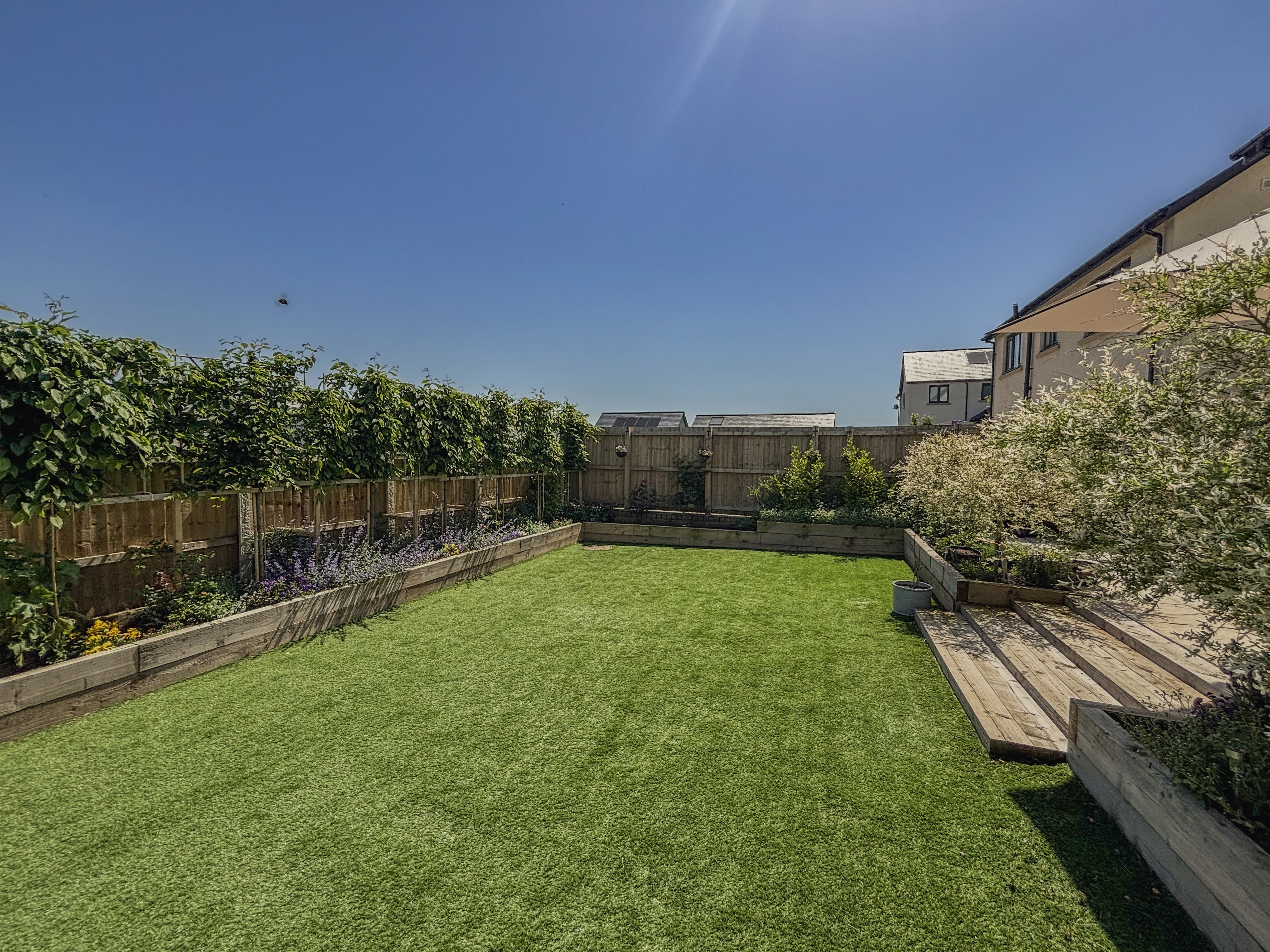 contemporary glass home with lawn