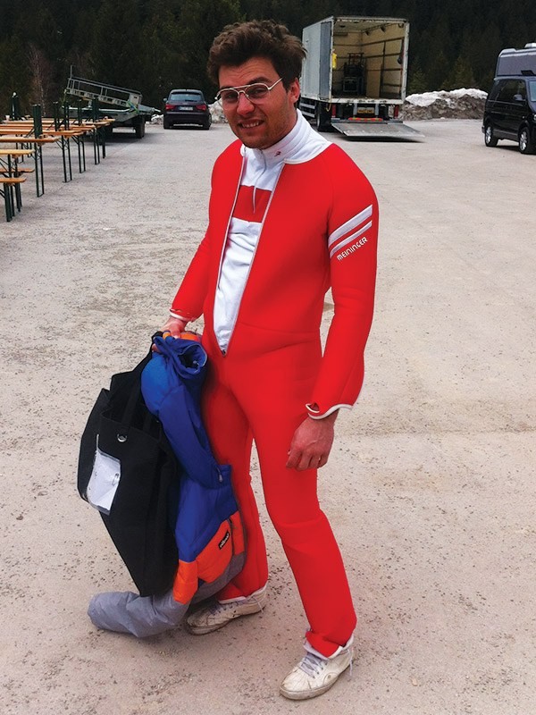 Tobi Deckert as his ski double in the identical red jumping suit — that is how the swap becomes invisible in the edit
