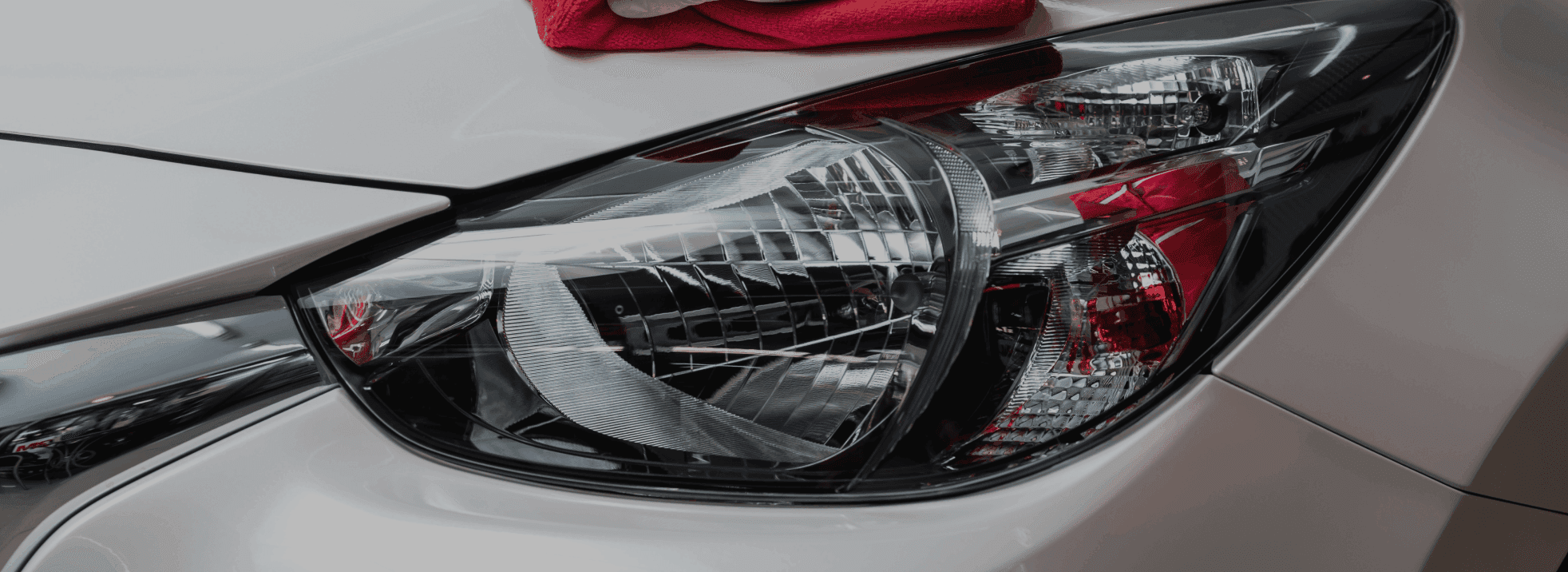 Red vehicle headlight and polished finish