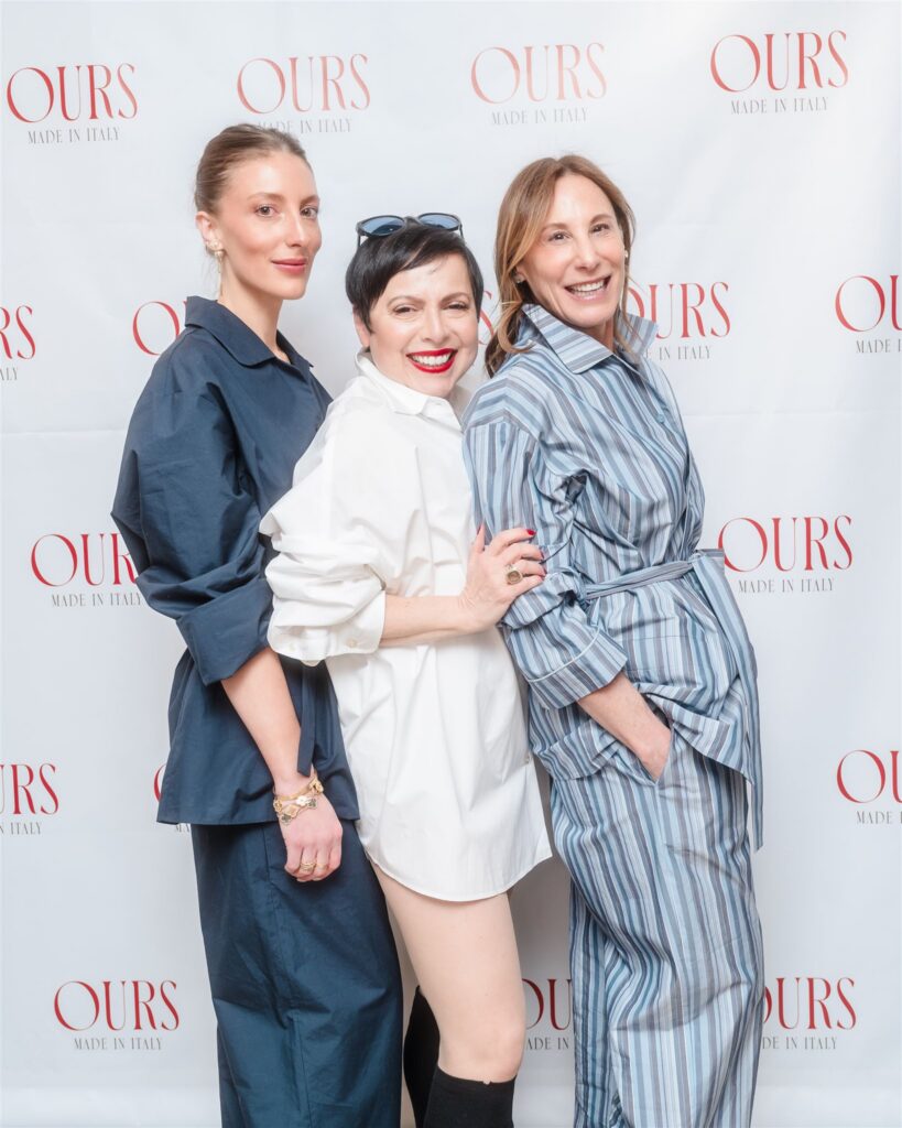 Three women in coordinated blue and white button-down sets smiling for a profile shot, emphasizing a cohesive and high-fashion brand presentation.