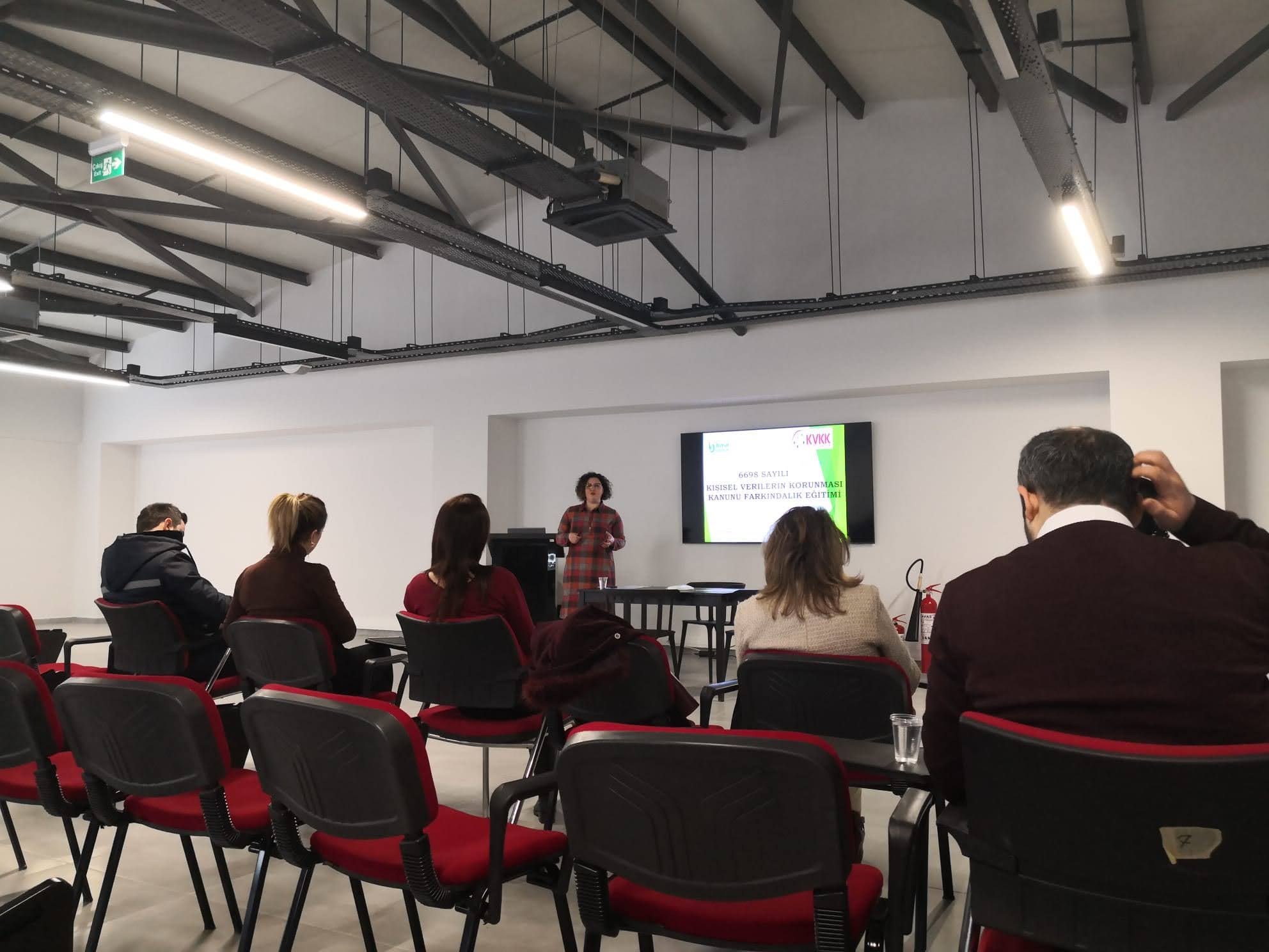 Close-up of a tree stump showing growth rings and a textured brown wood surface.