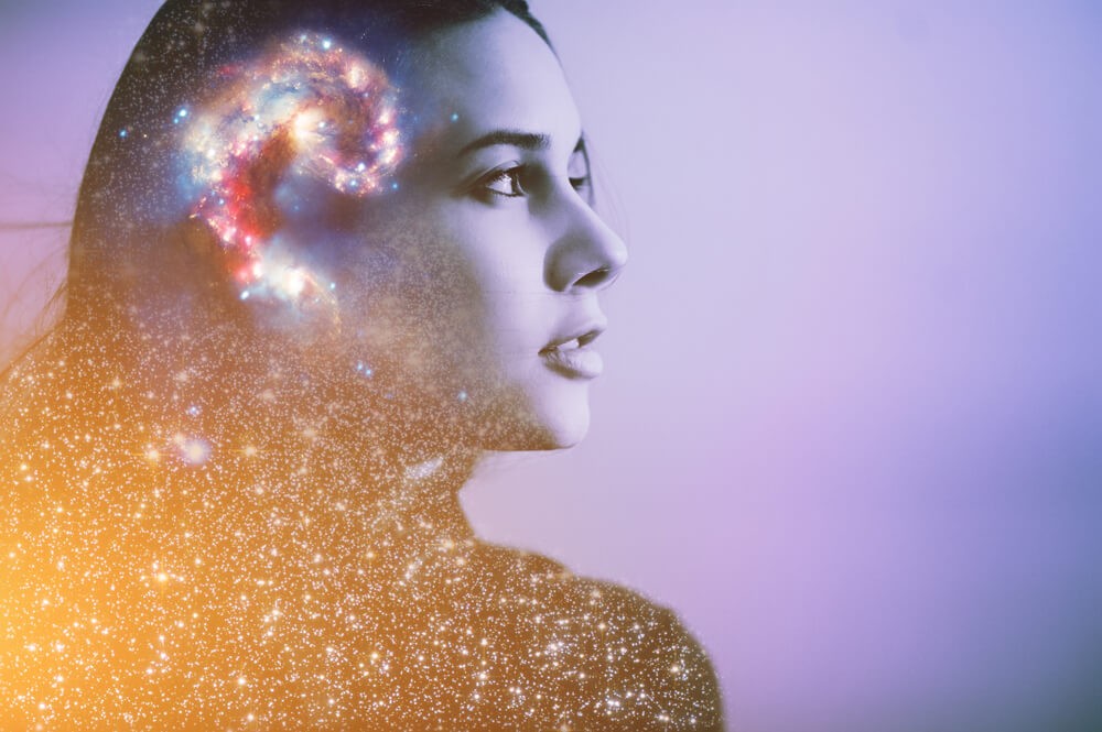 Surreal portrait of woman with galaxy overlay symbolizing the mind