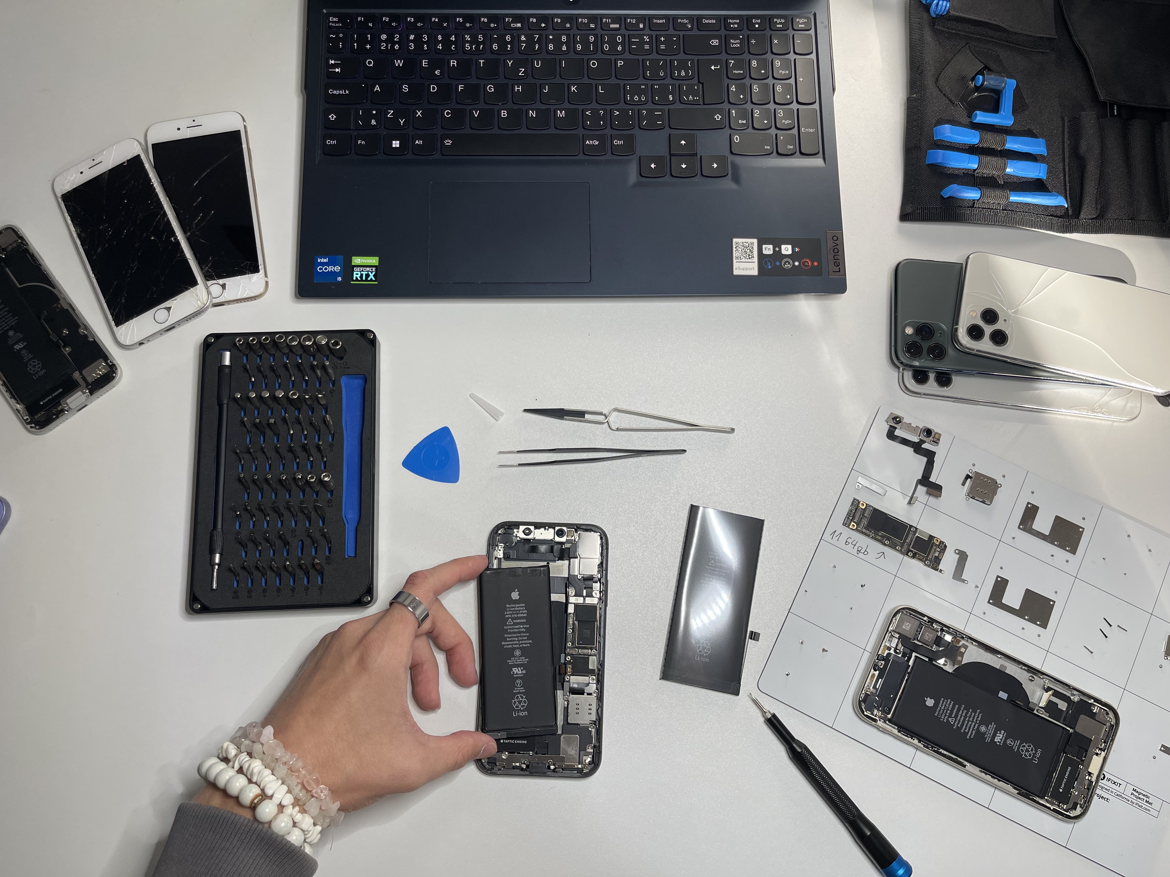 woman holding a phone and man looking at the phone. both are smiling