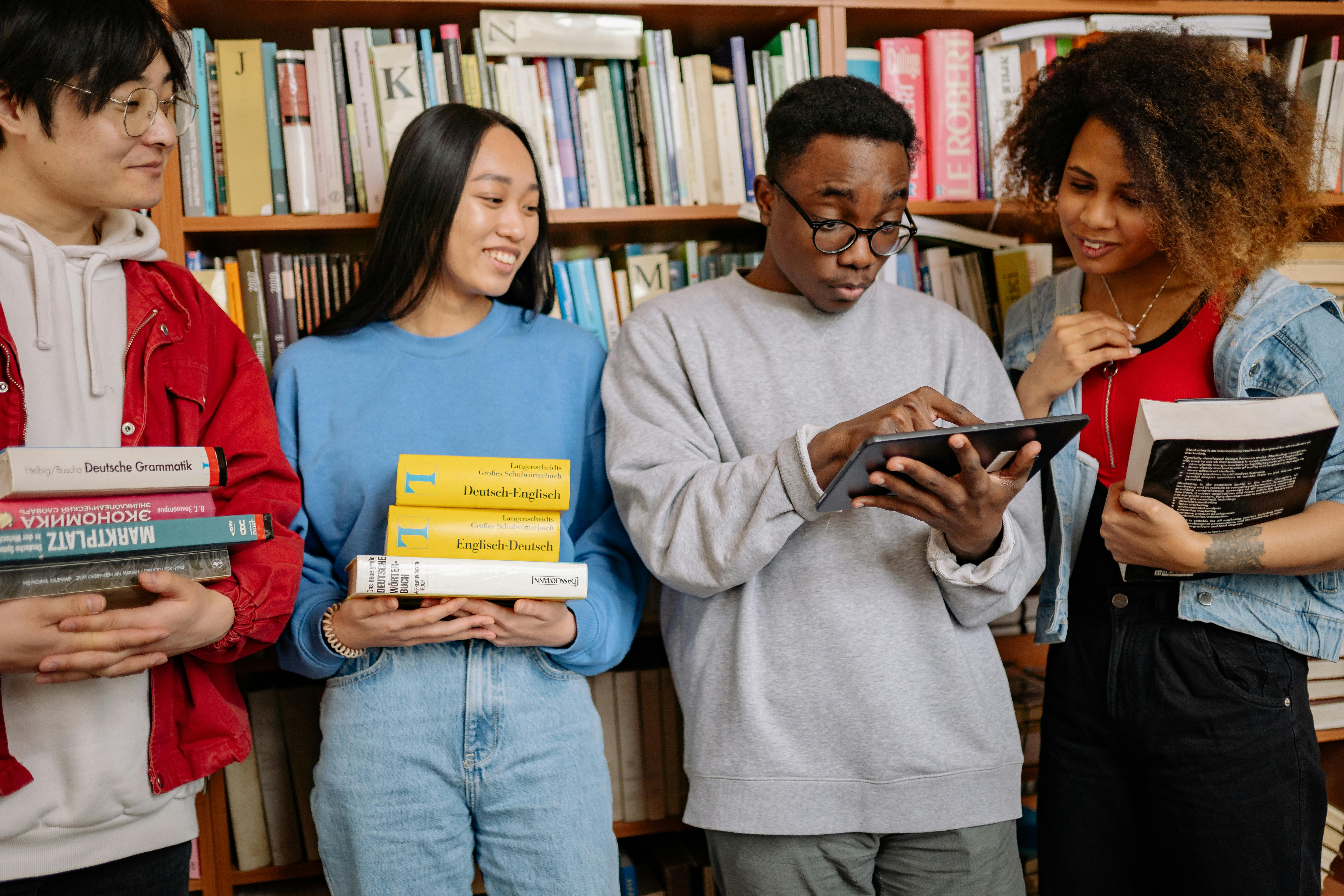 Friends Looking at the Digital Tablet during a study group