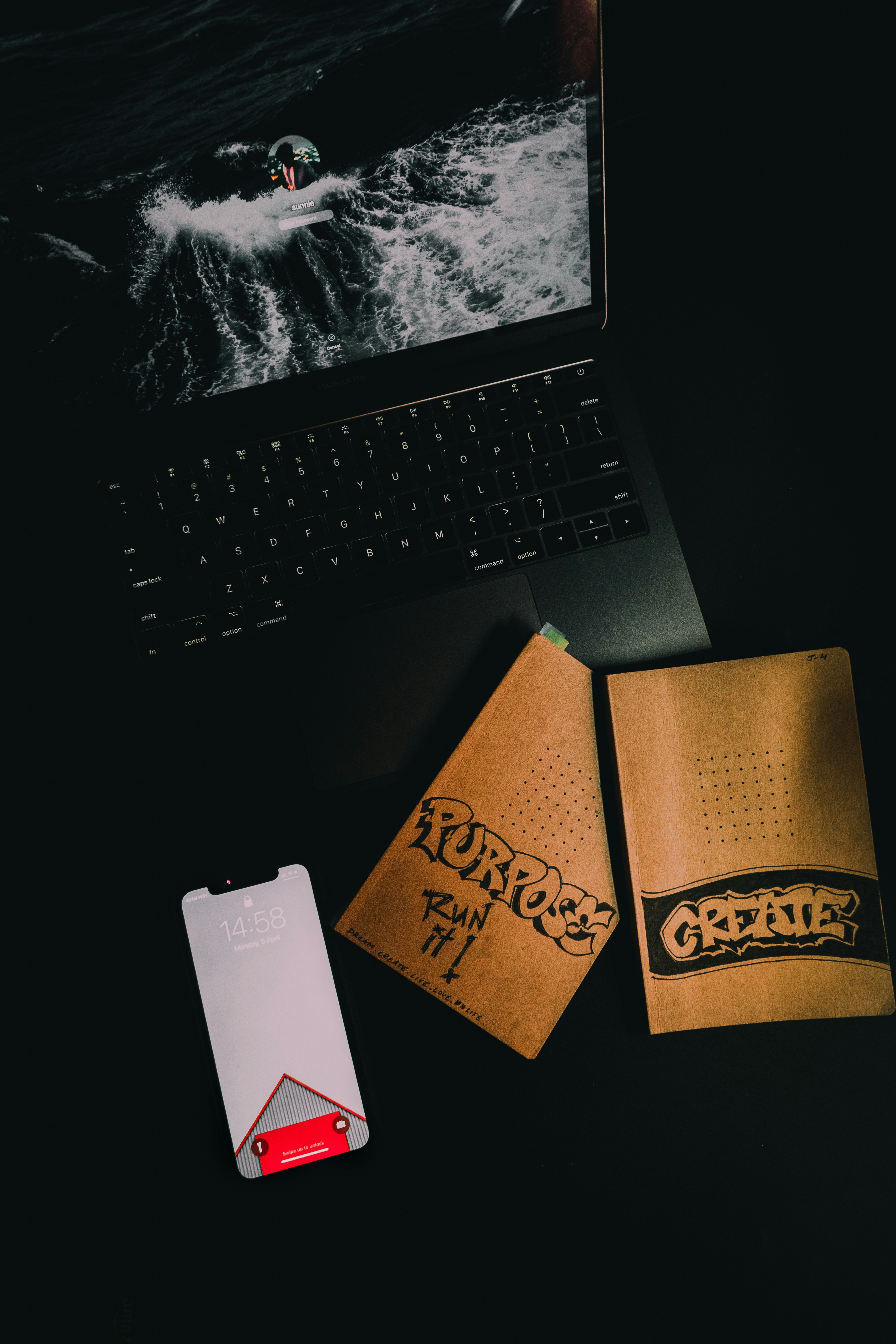 black laptop computer beside white card