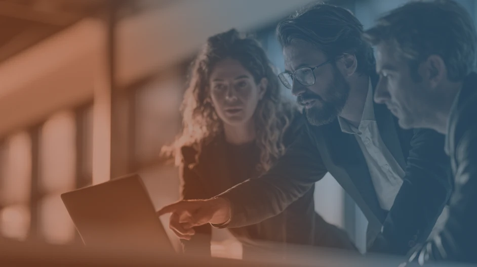Recruiters looking at computer with gradient overlay