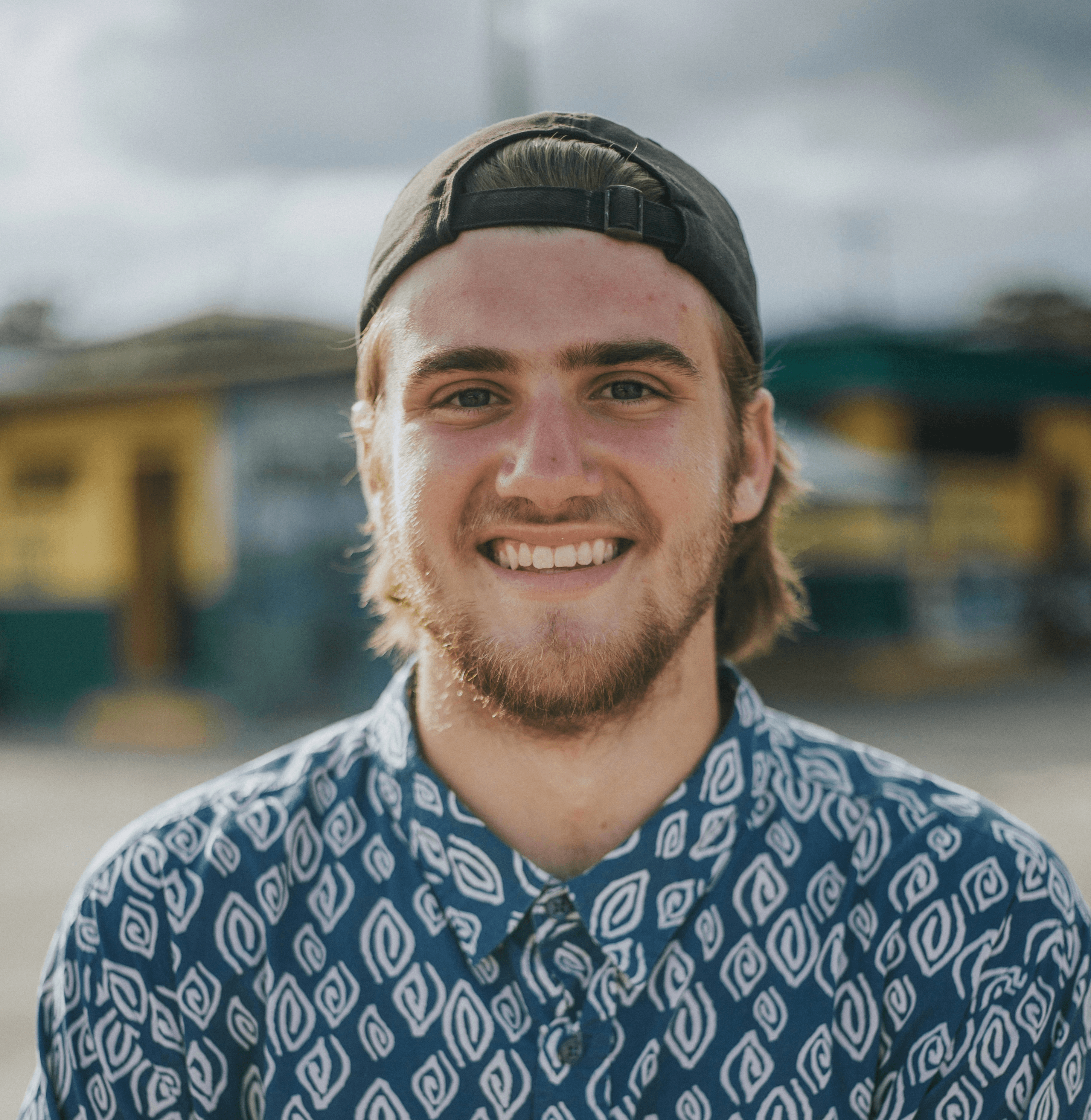 person wearing blue top smiling