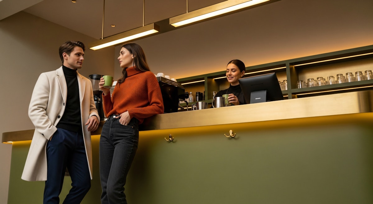 man and woman sitting on chair in front of table