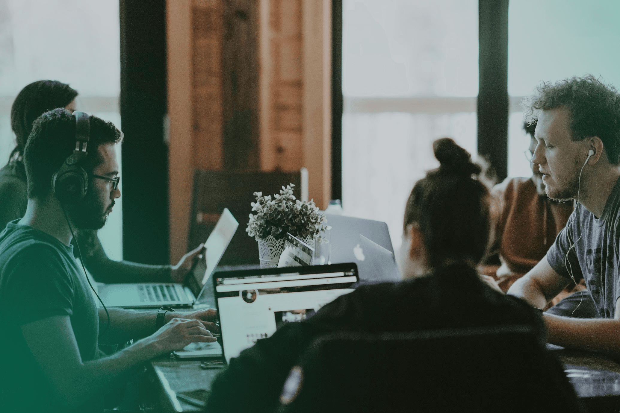 A diverse team working collaboratively in a modern office, representing personal and institutional transformation.