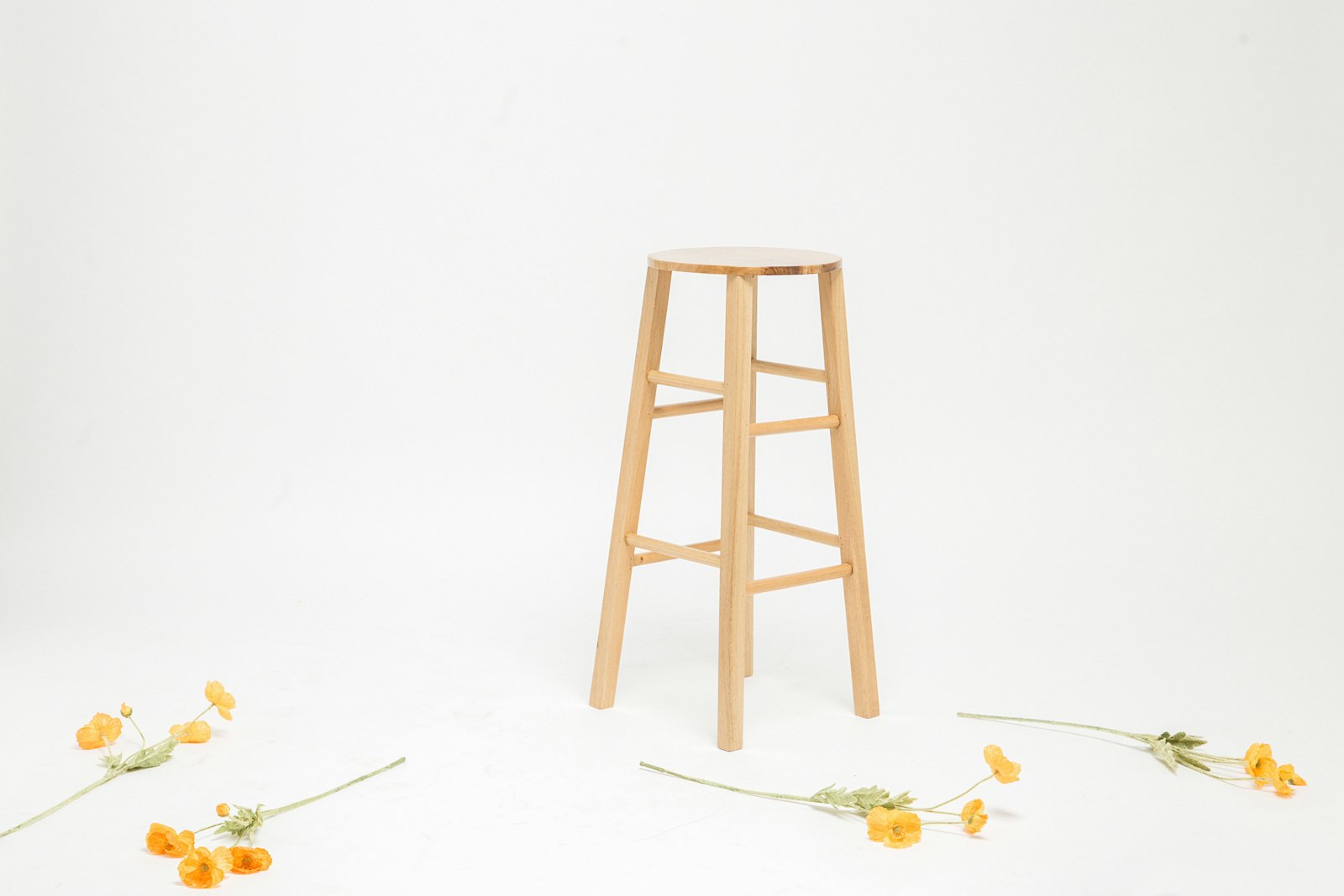 Small wooden stool on a light floor