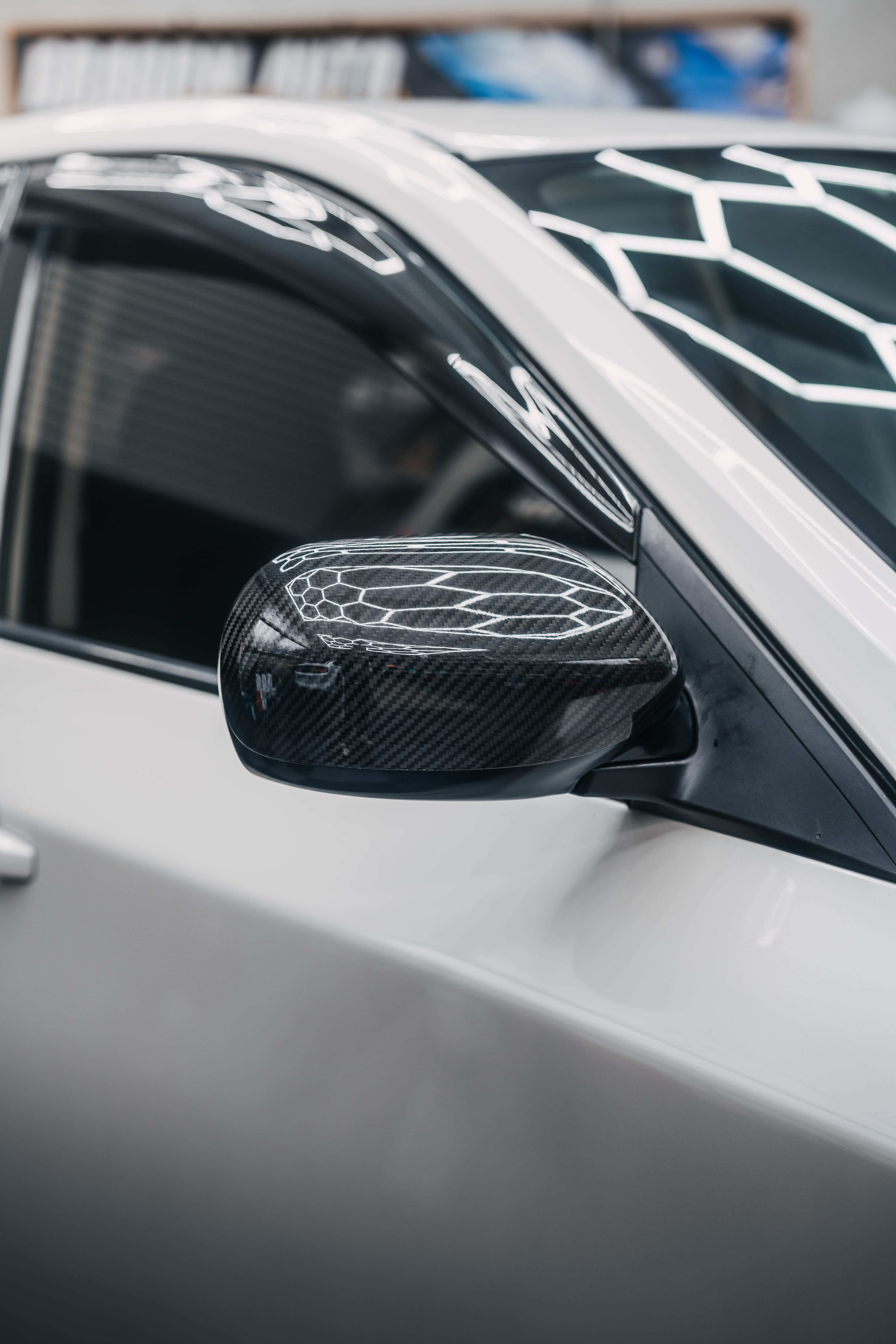 Mirror detail on a white Subaru WRX Hatch showing Icon Rocklear permanent paint protection, Dragon Auto Milpitas