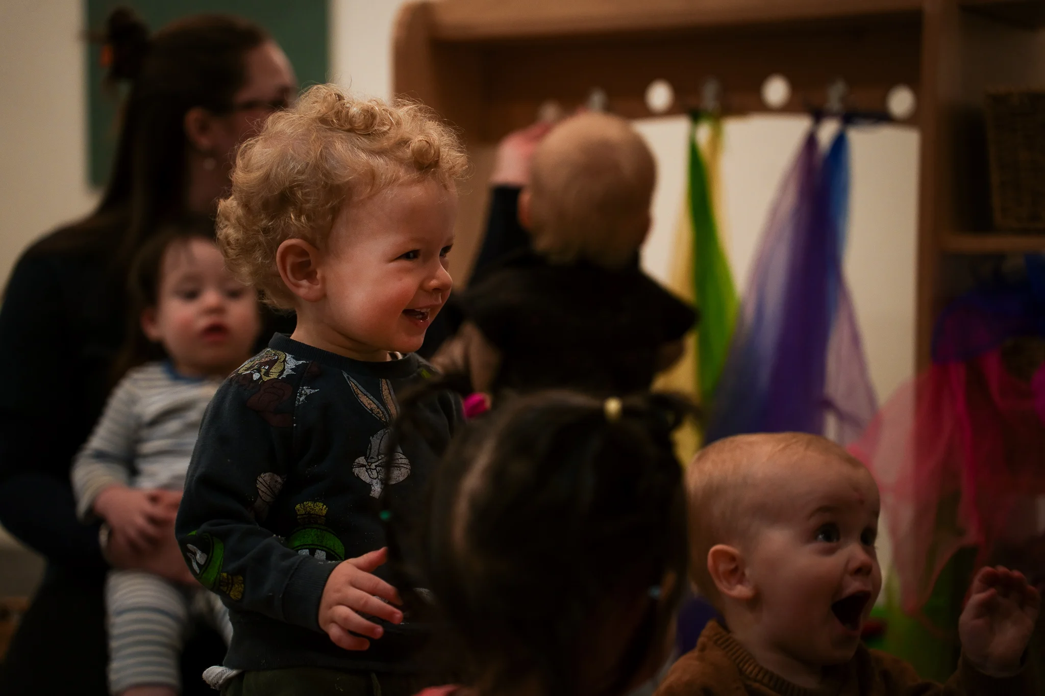 A young child exploring the outdoor environment during playtime.