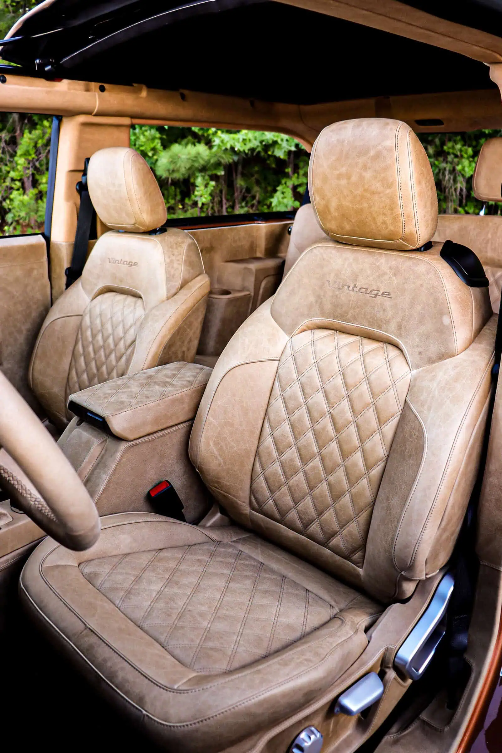 Man with camera near lake and mountains