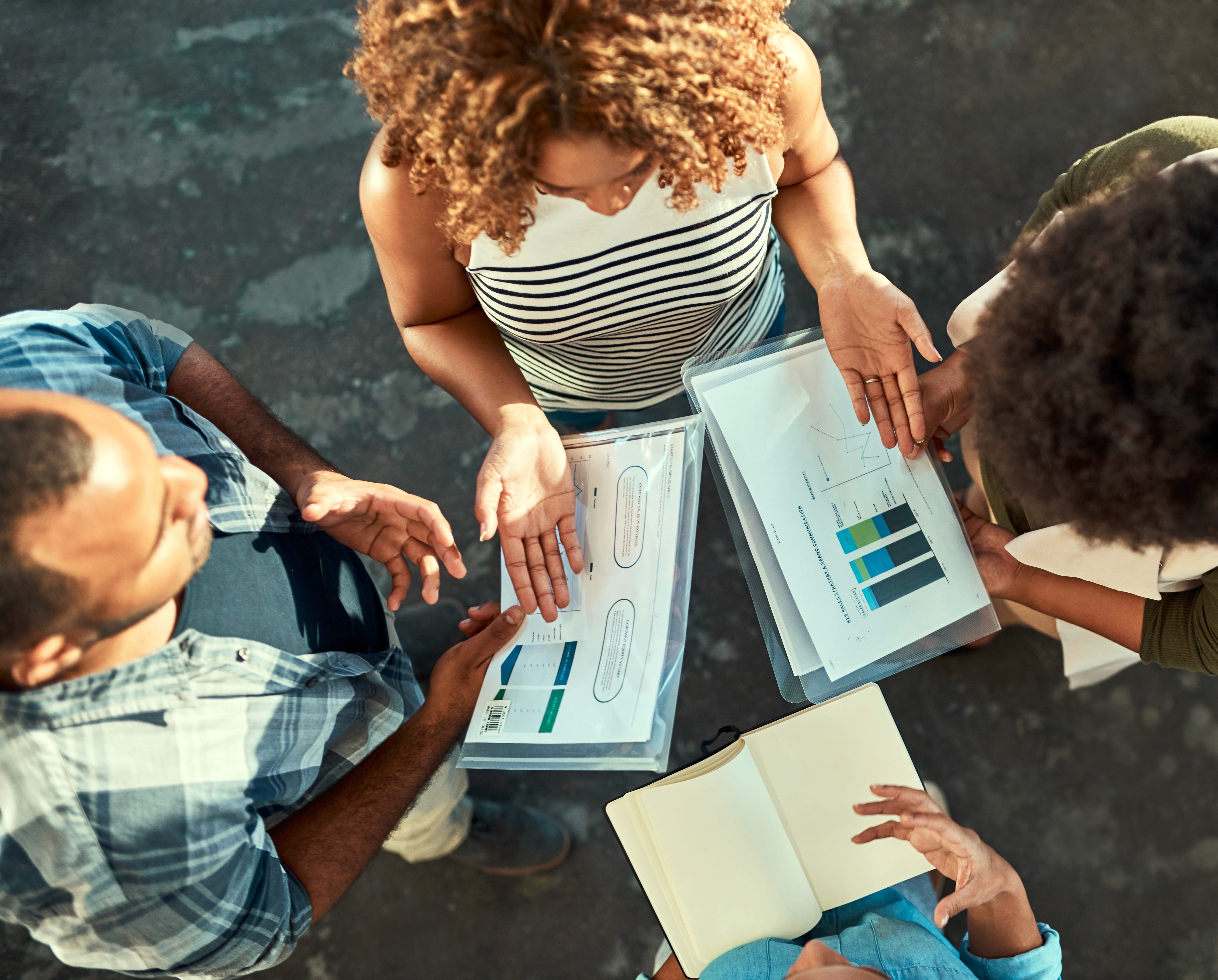 Professionals holding boxes filled with various items