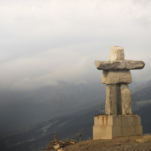 Inukshuk surrounded by gorgeous mountain views