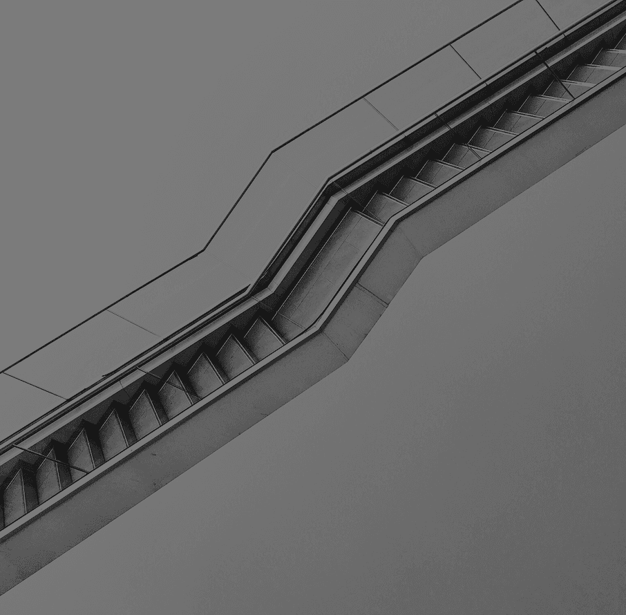 An abstract image with soft, out-of-focus light circles against a dark background.