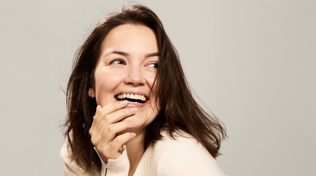 Man with brown hair and mustache smiling