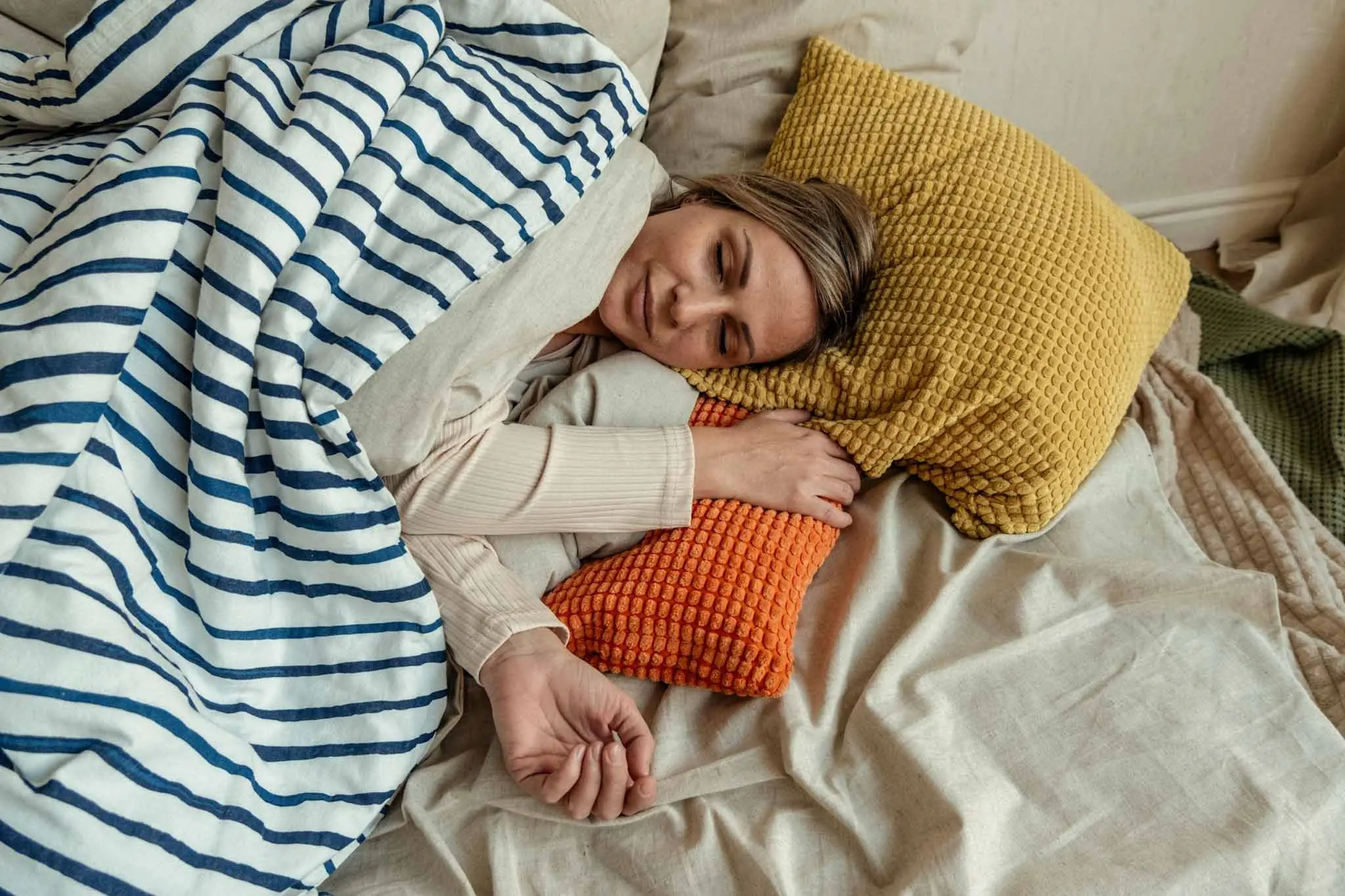 a woman lying in a bed