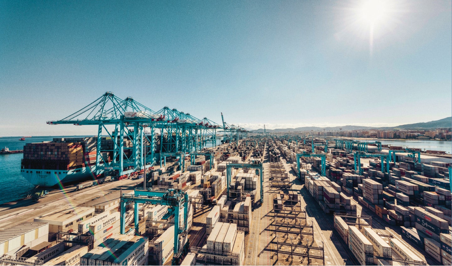 Maersk Go — aerial view of a large container shipping port with cranes and stacked Maersk containers — Soda Studio case study