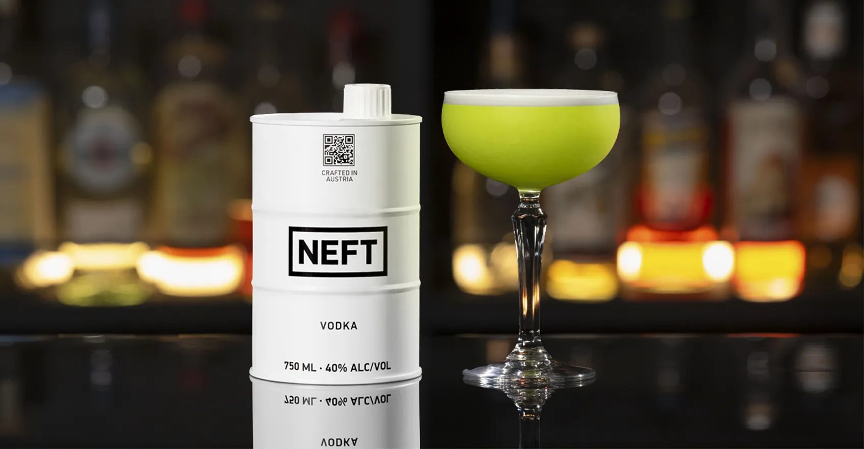 A NEFT Barrel and a glass of Irish Clover on a bar counter.