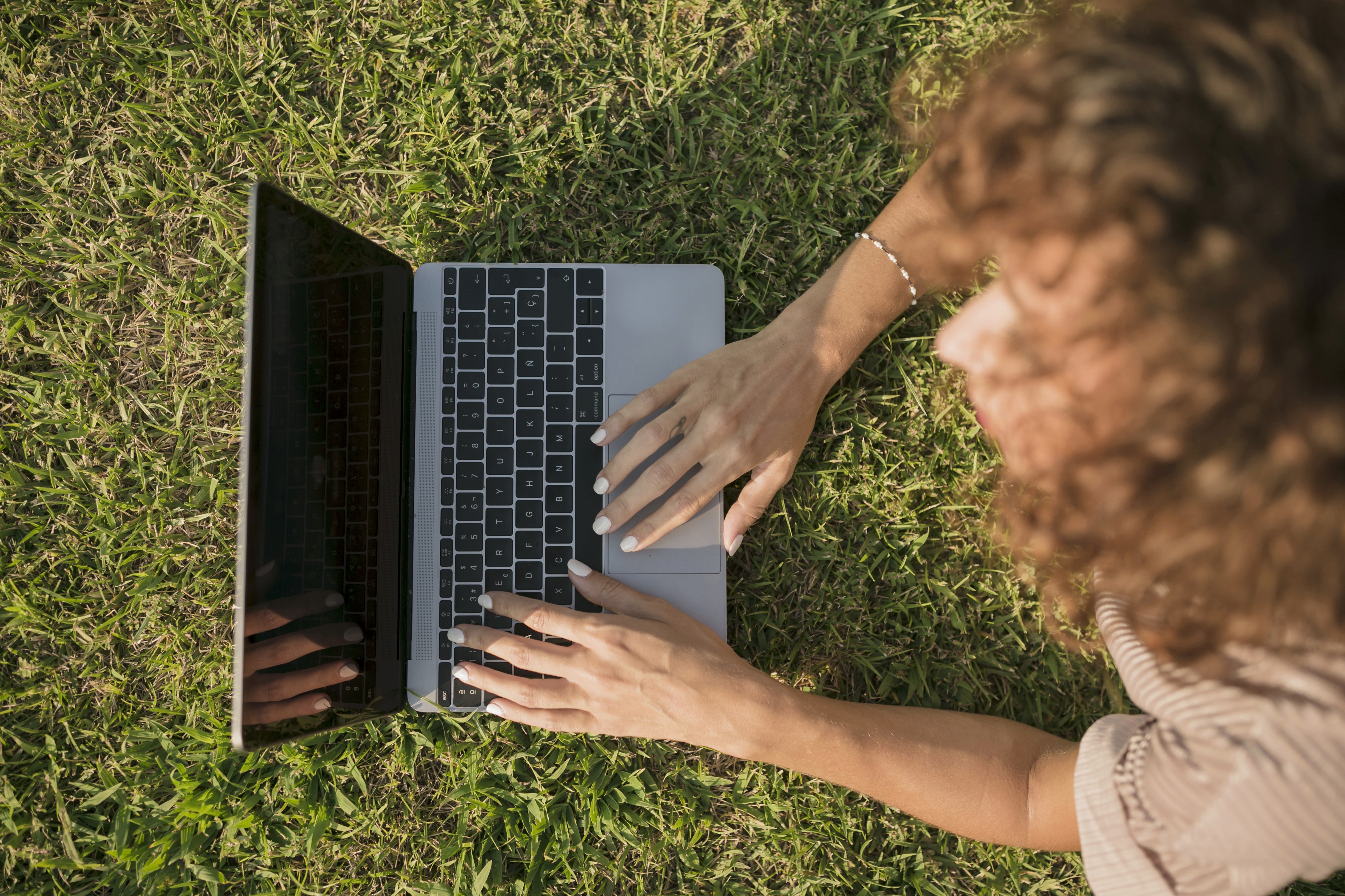 people sitting on chair in front of laptop computers
