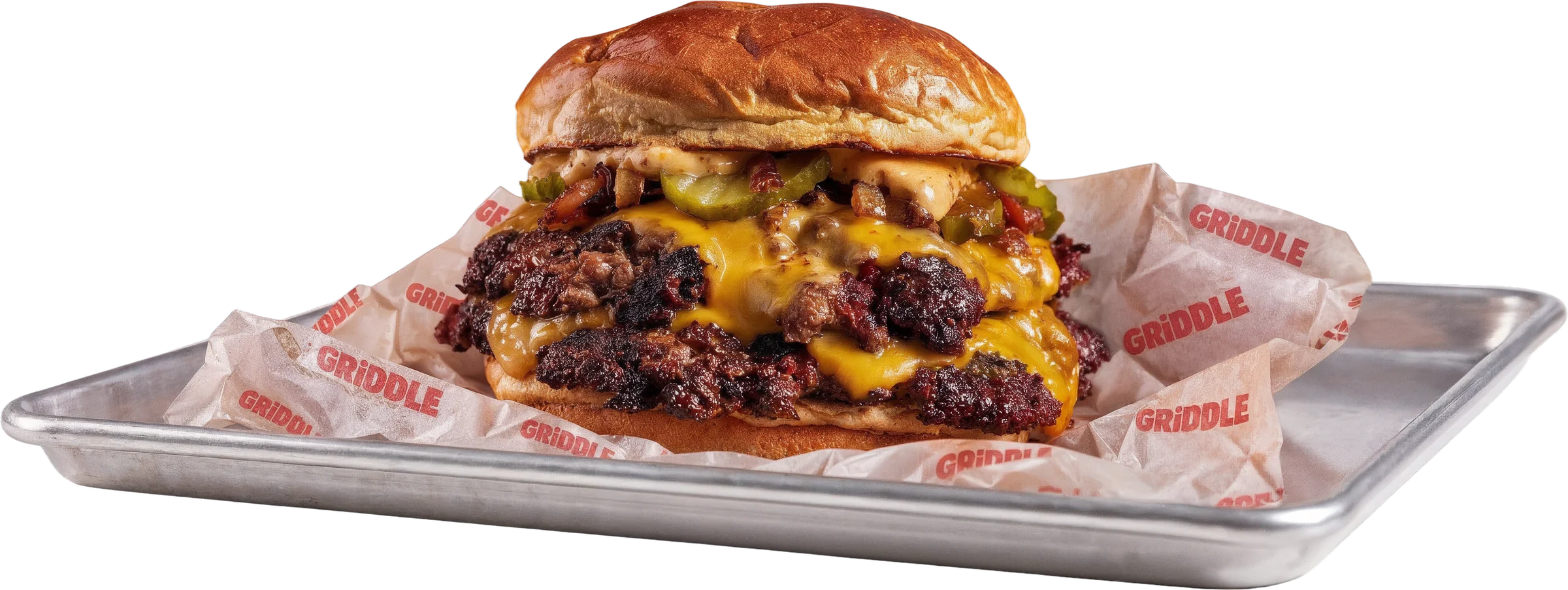 Double smash burger with melted cheese on a tray with GRIDDLE paper