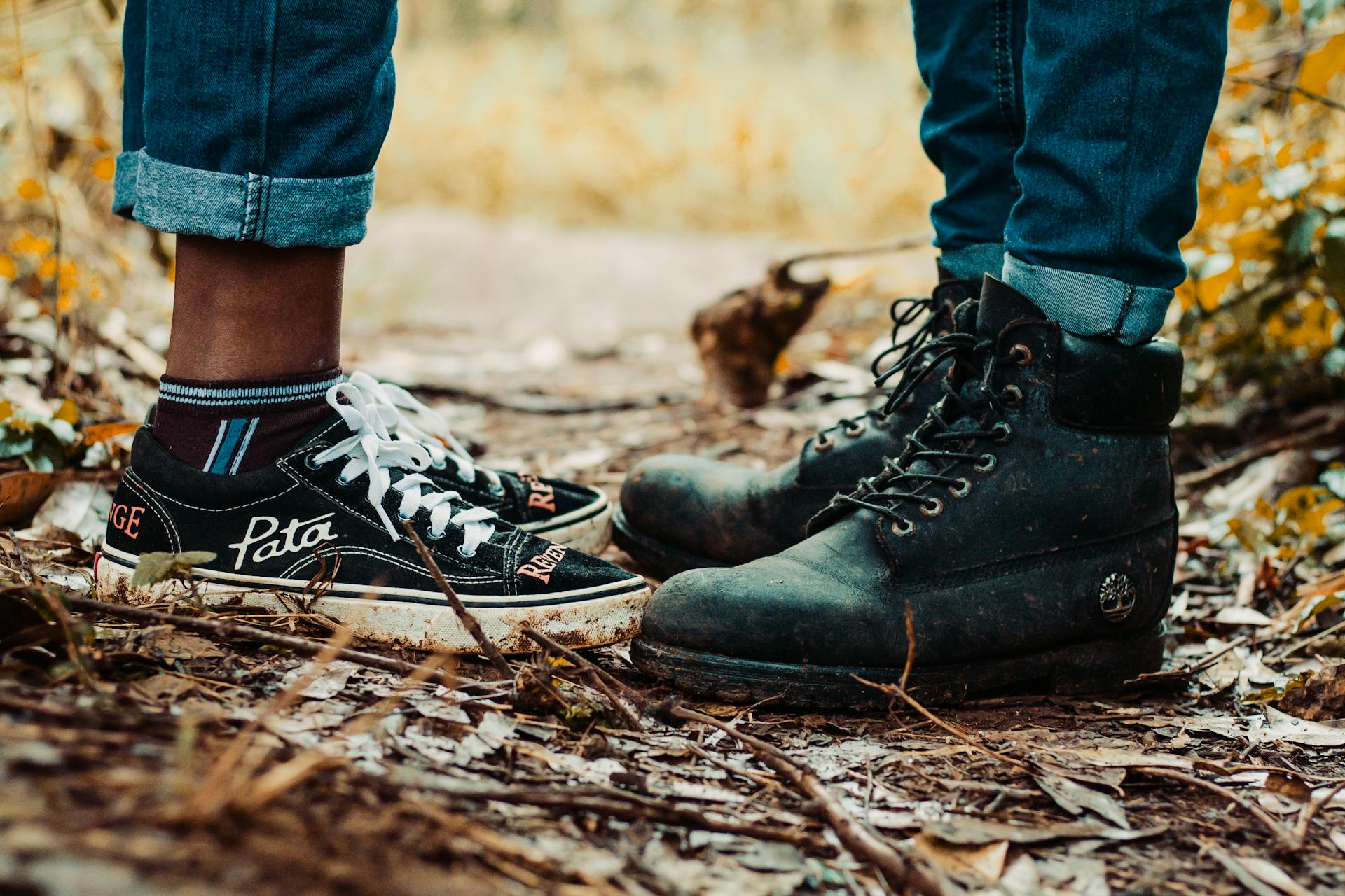 Couple boots in the leaves