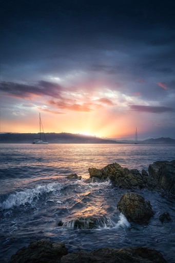 White sand beach with sunset in the background