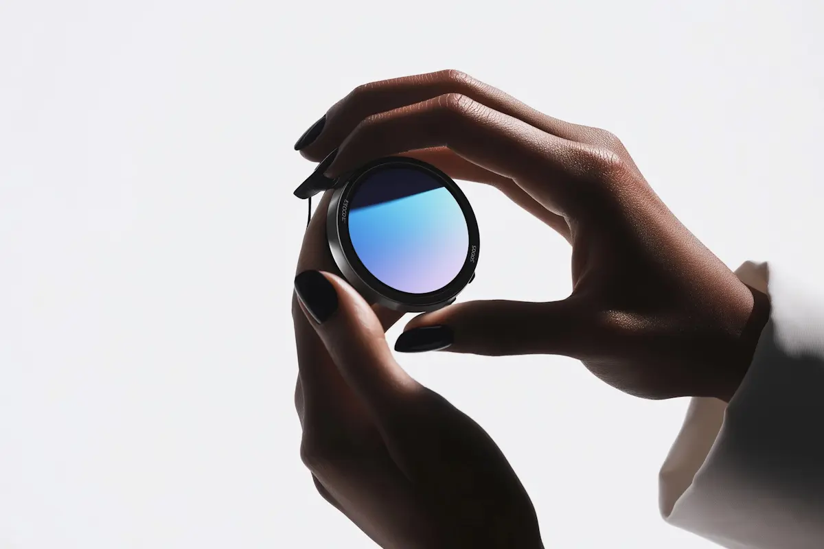 Woman holding camera lens