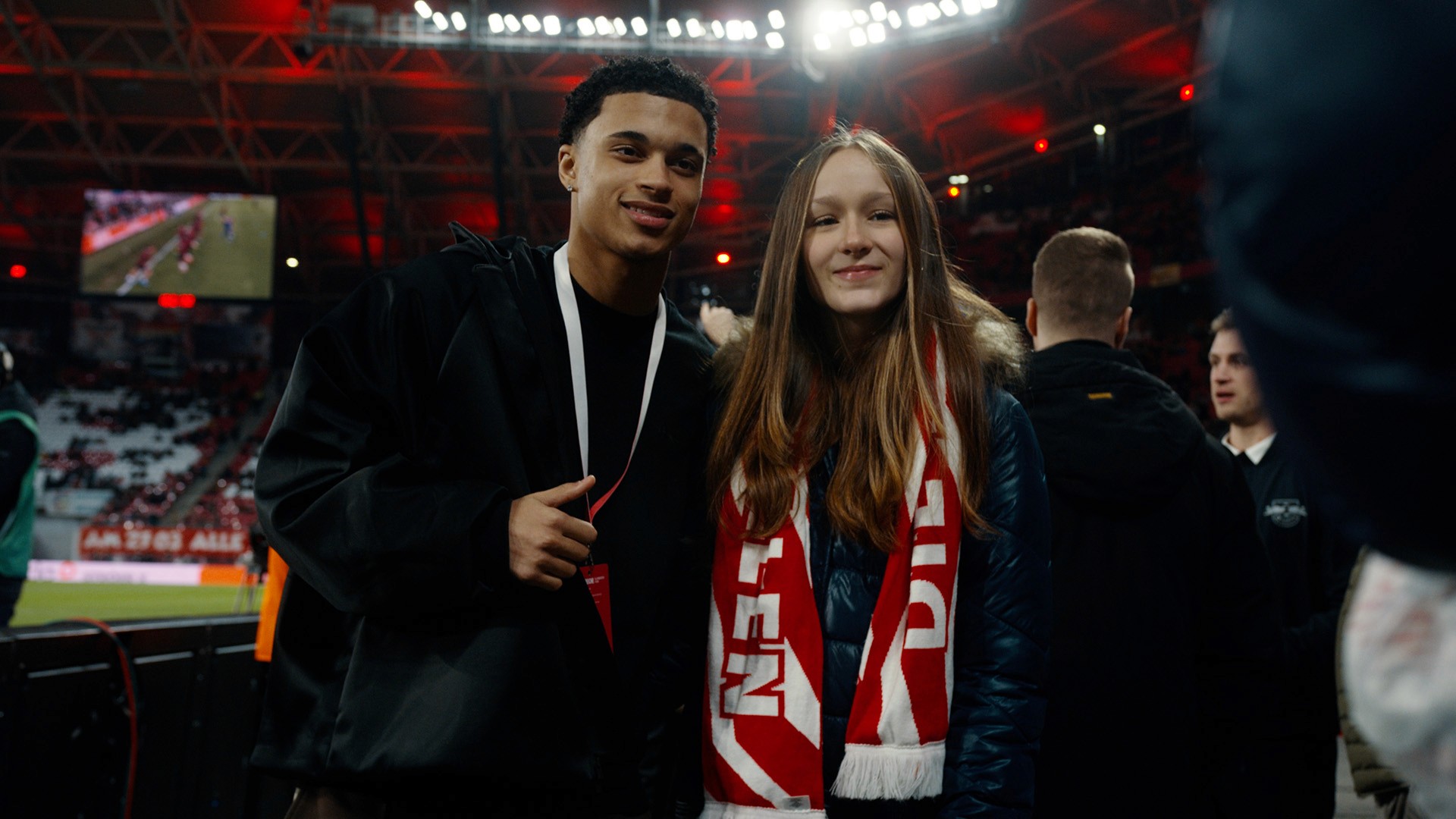rbl youth player in RB Leipzig stadium with fan