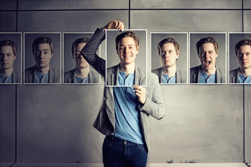 Man biting nails, looks worried or anxious