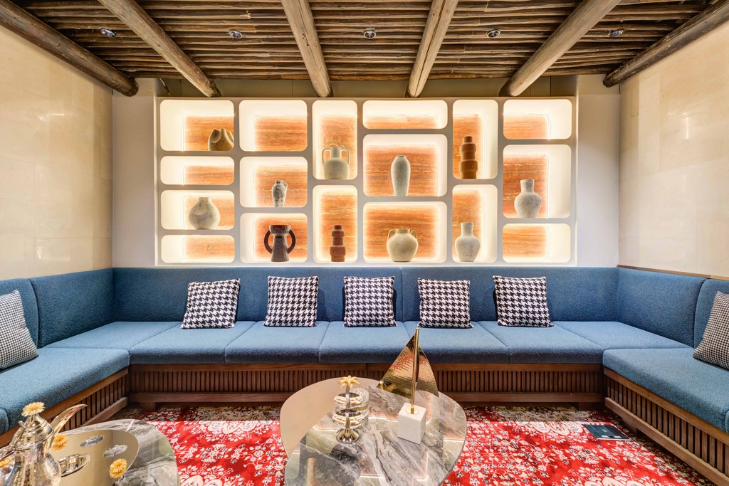 Remote work setup at TEC KSA with laptop and beverage in stylish coworking café