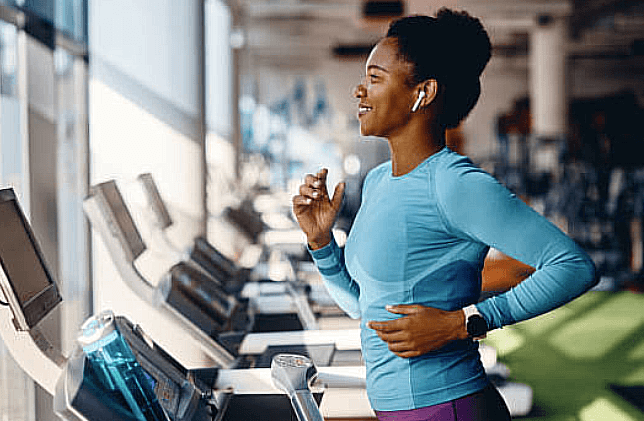 Fitness tech laid out for the gym: a wearable, earbuds, smart scale and recovery tool
