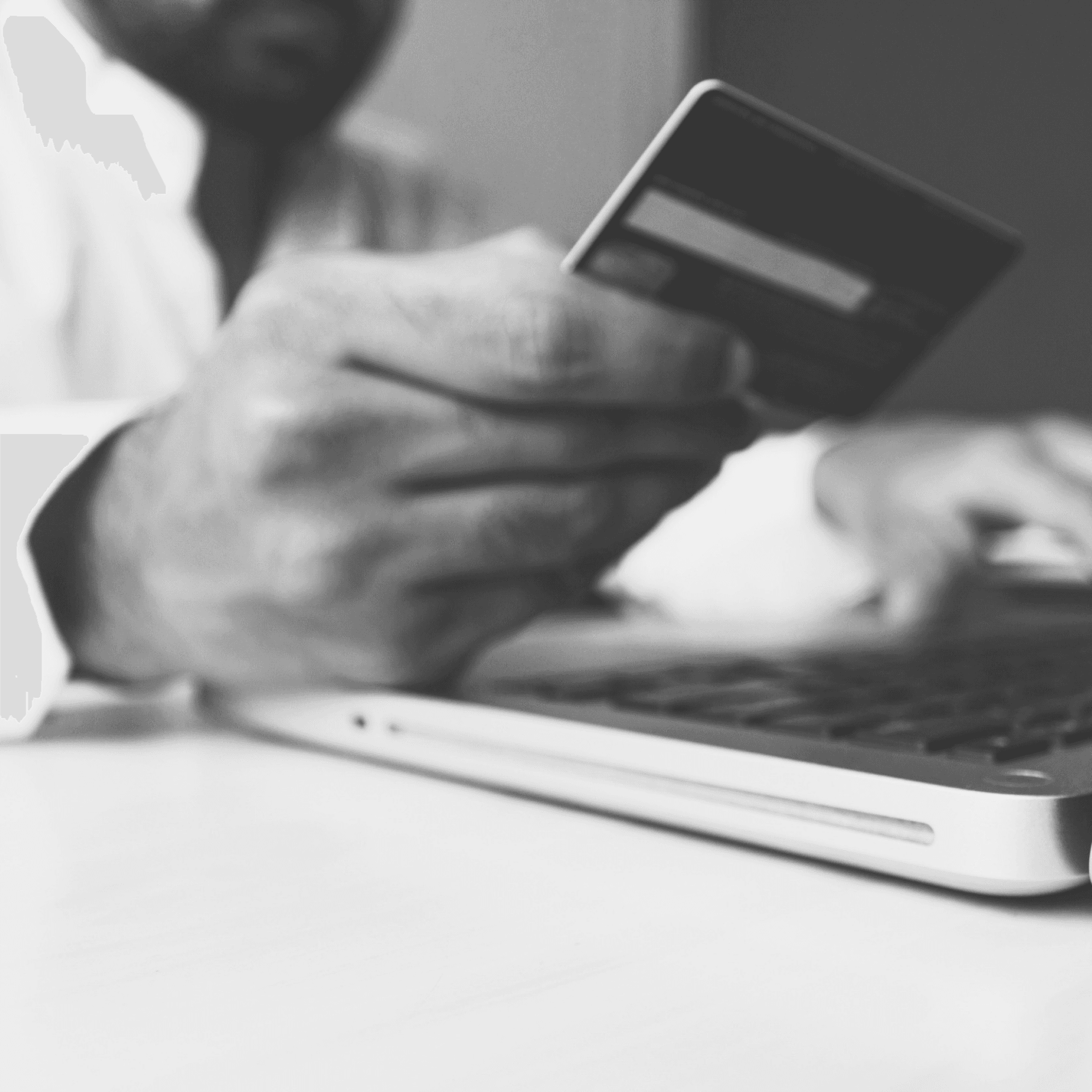 Man entering credit card details for online purchase