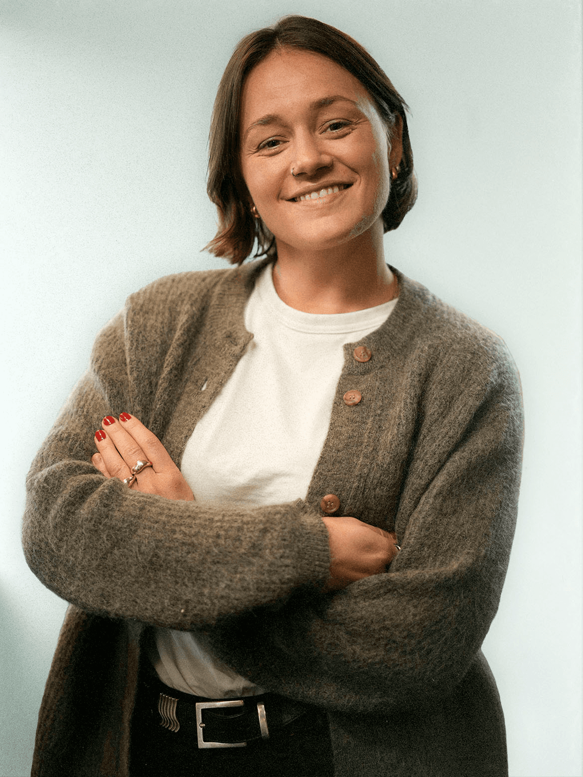 man standing beside wall