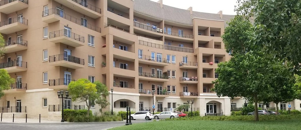 Aerial view of Motor City from the building's summit, featuring the city's streets and structures in the distance.