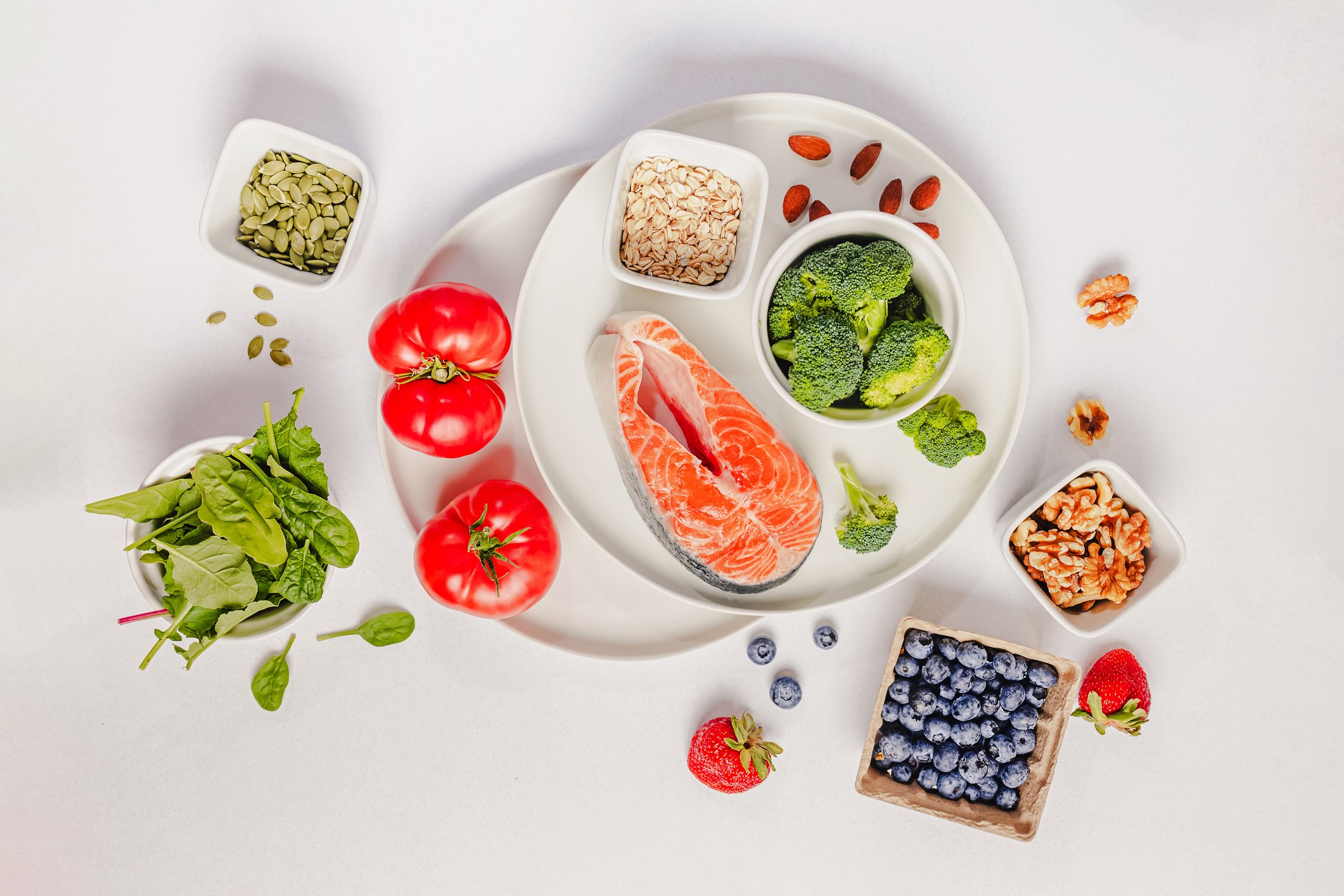 A variety of fresh fruits and vegetables, showing balanced, non-restrictive eating with no food off-limits.
