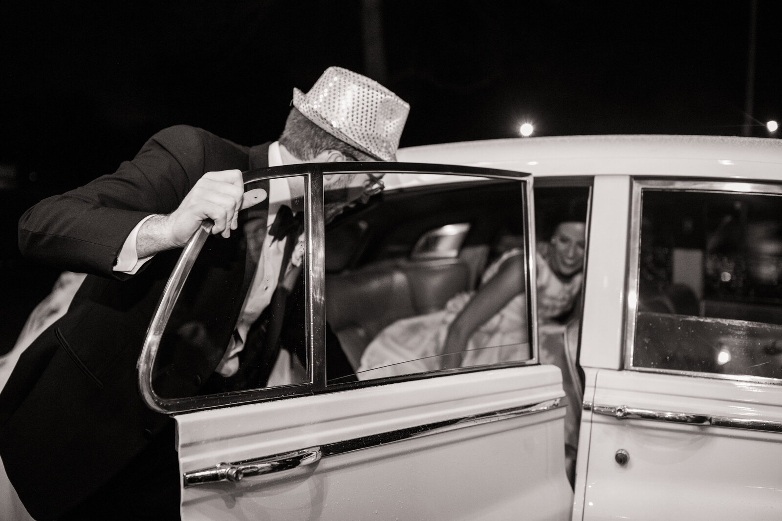 The bride and groom’s sparkler send-off at The Estate at Cherokee Dock captured in black and white photography.