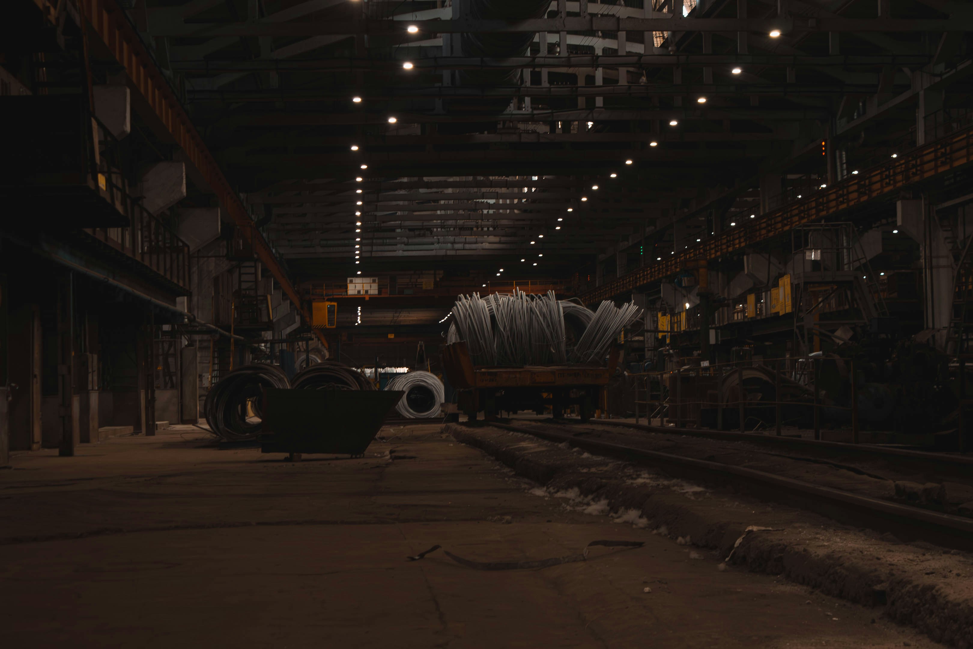 A train traveling through a train station next to a loading dock