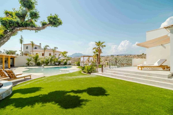 Luxury villa with pool and manicured lawn
