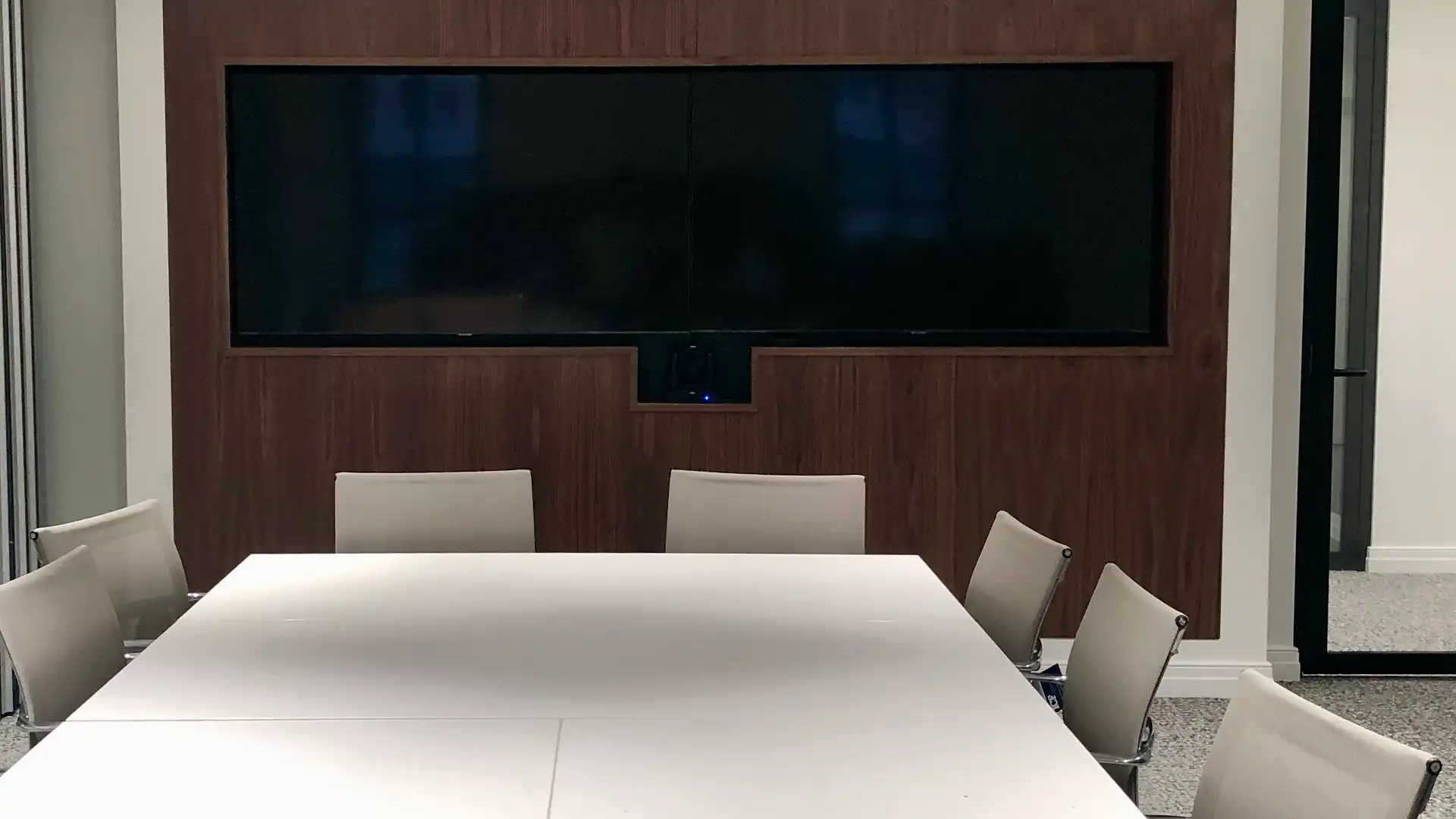 Dual displays installed in an executive meeting room