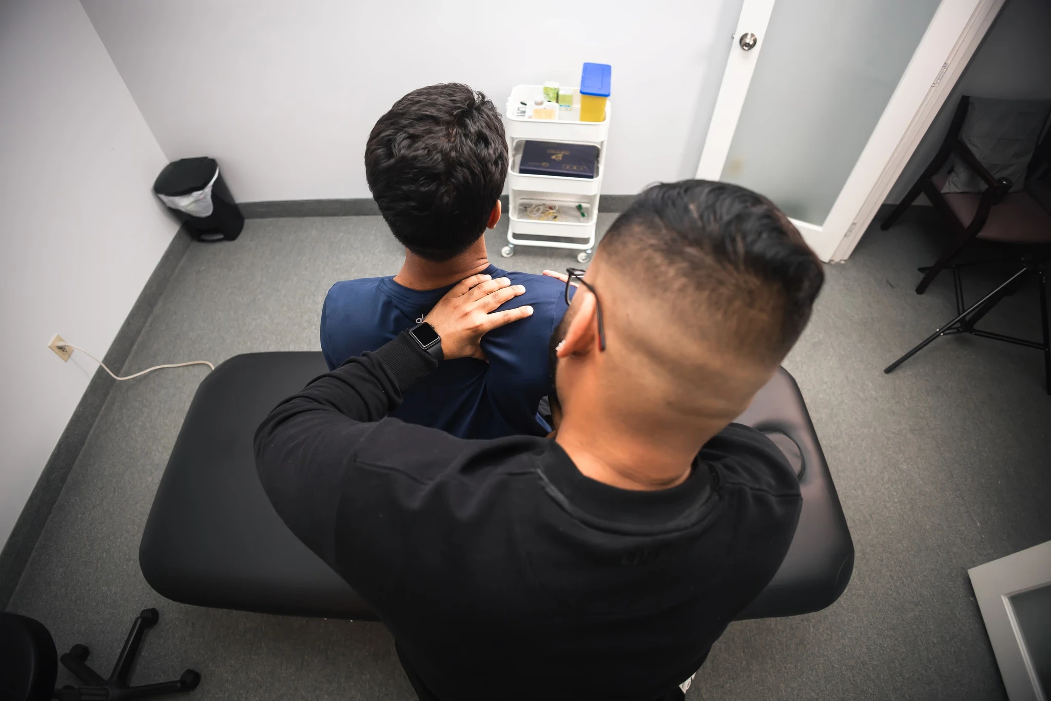 physiotherapist performing joint mobilization on patient’s shoulder