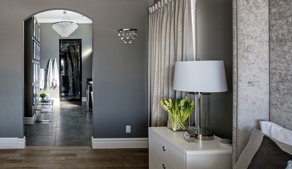 Image of Luxurious primary suite with elegant lamp, vase, and window coverings by KHD Homes interior design.
