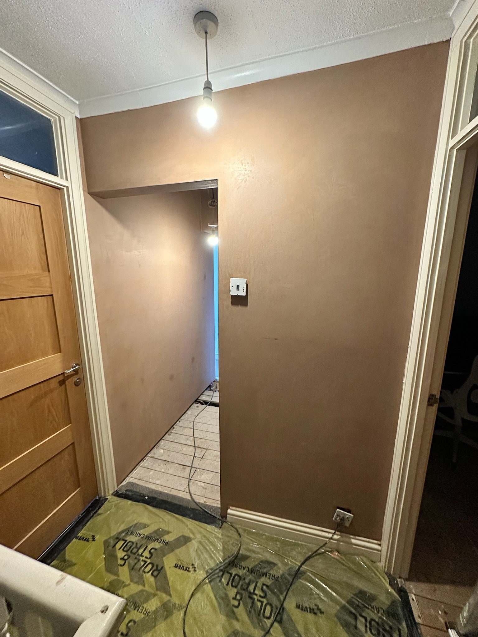 Freshly plastered landing doorway.