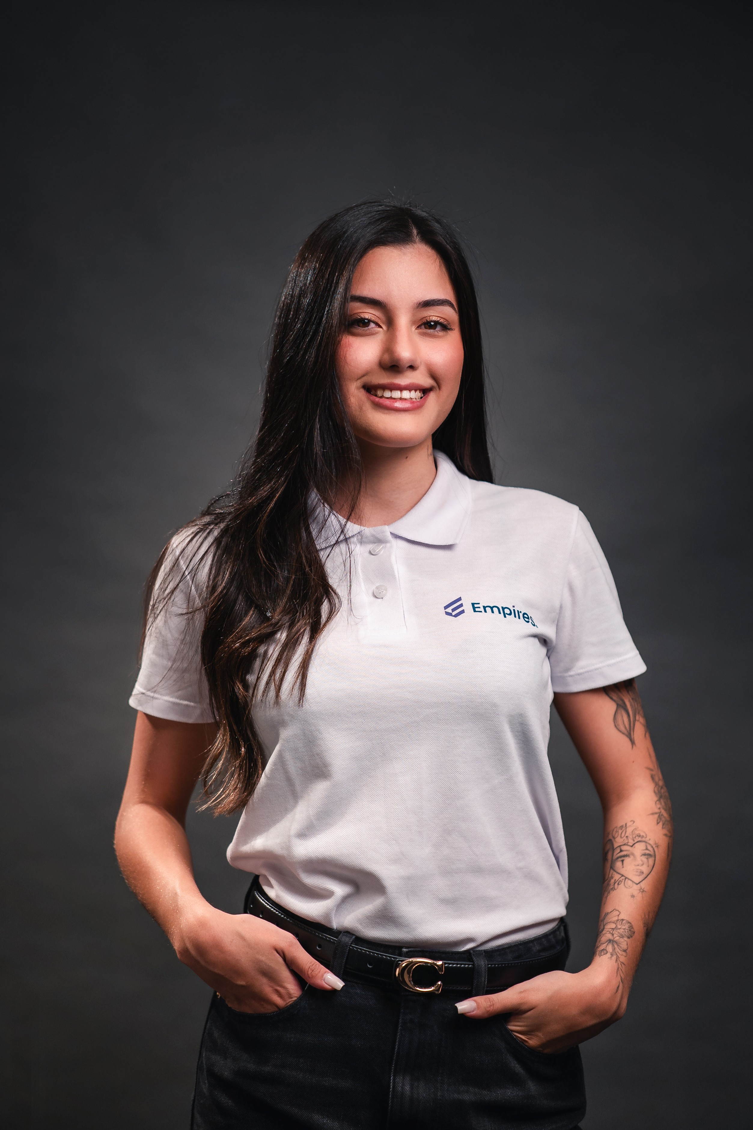 woman in black crew neck t-shirt wearing brown framed eyeglasses standing on rocky shore during