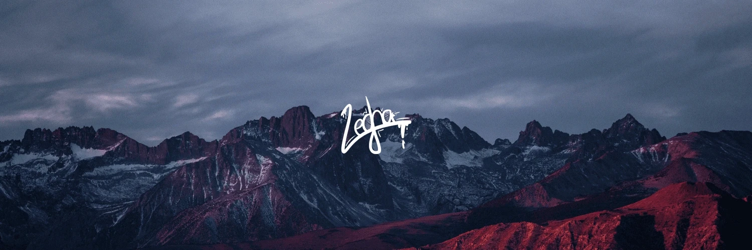 Panoramic view of a rugged mountain range at sunset with dramatic clouds and snow-capped peaks, red themed, itzlegha logo