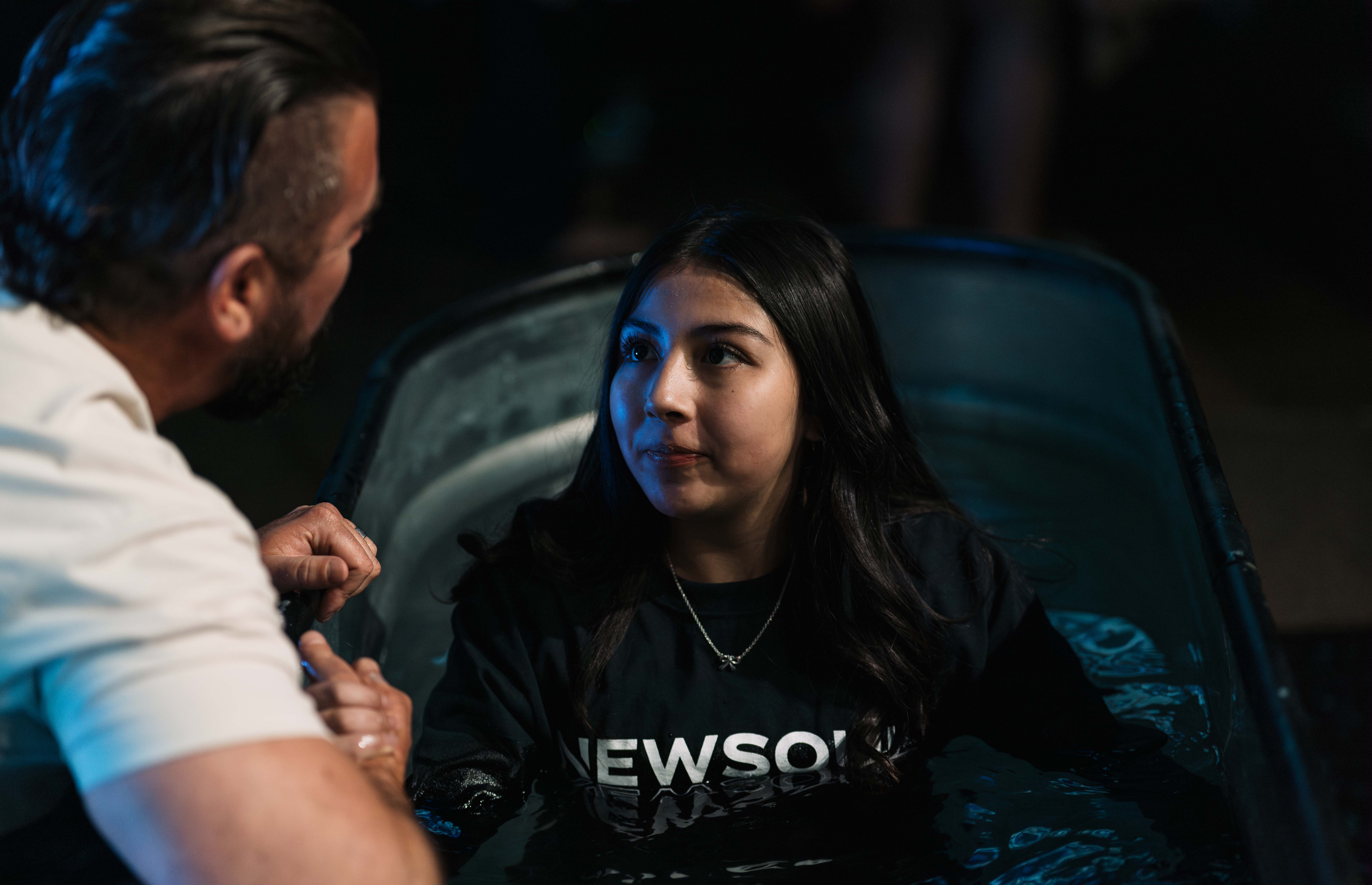 Young women being baptised