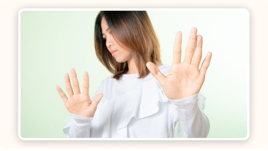 Woman in a “stop” gesture