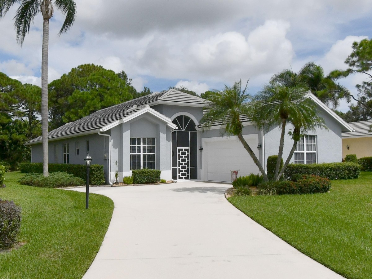 1995 New Roof Construction in Marsh Landing, PGA Village, Port St Lucie with Entegra Flat Broomswept Tile in Natural Gray